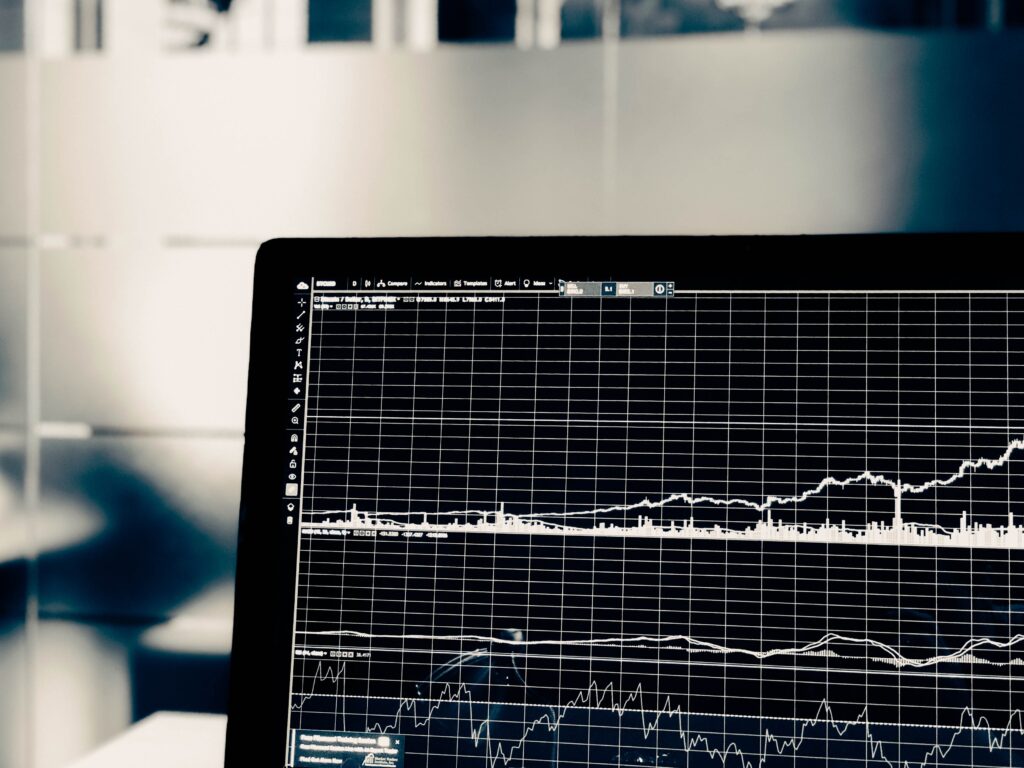 A laptop closeup shows a full screen line graph to illustrate the idea of ABM KPIs.