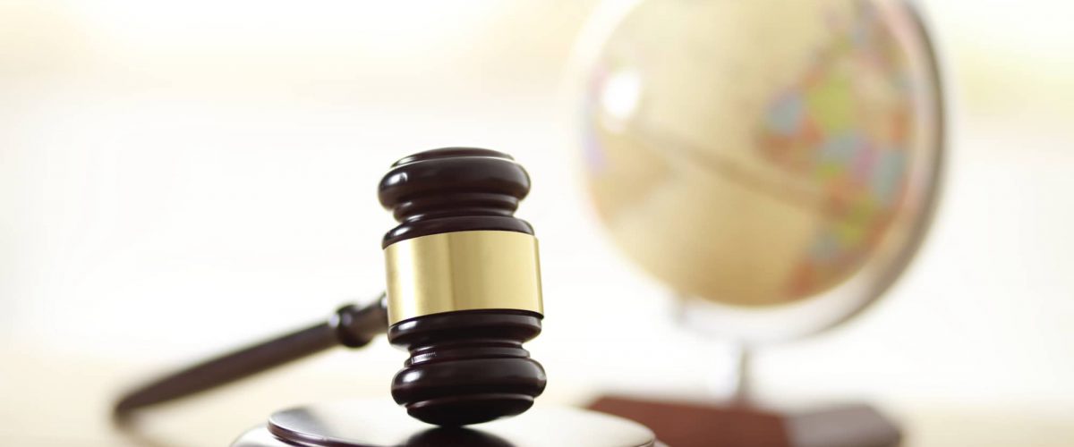 SMS marketing & GDPR compliance represented by a globe and gavel.