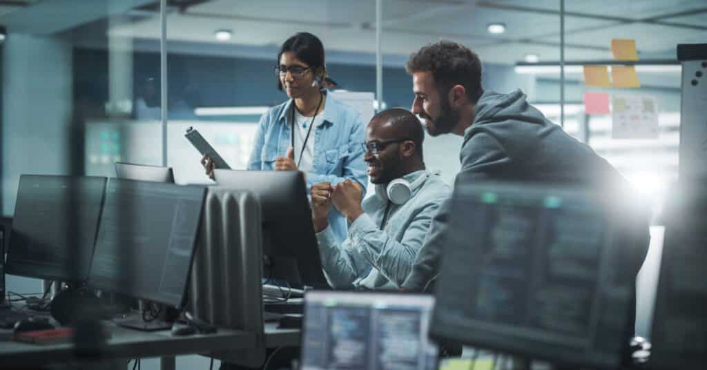 diverse team of tech workers represents the history of marketing automation