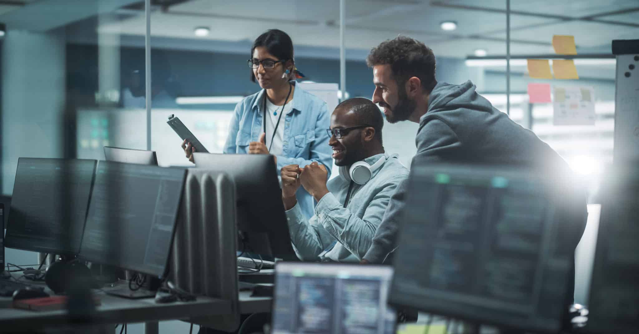 diverse team of tech workers represents the history of marketing automation